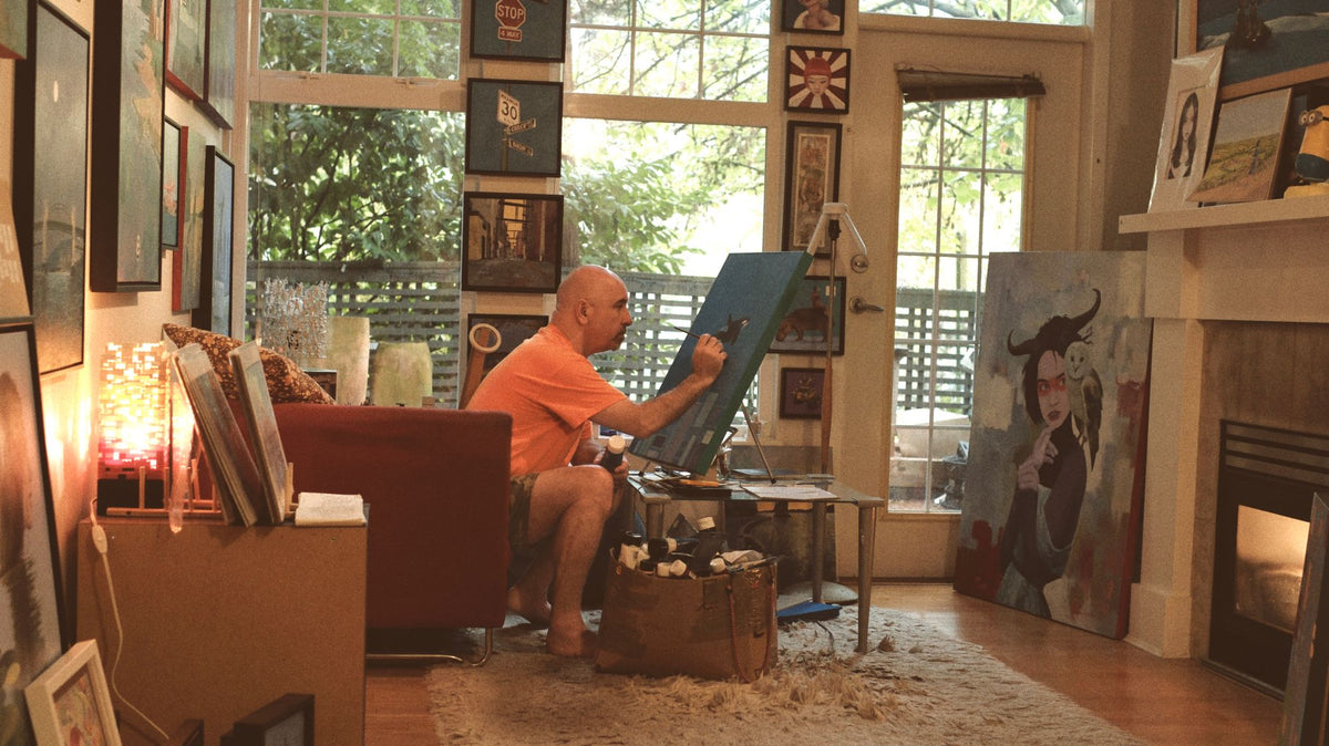 Marcus Wild painting in his studio