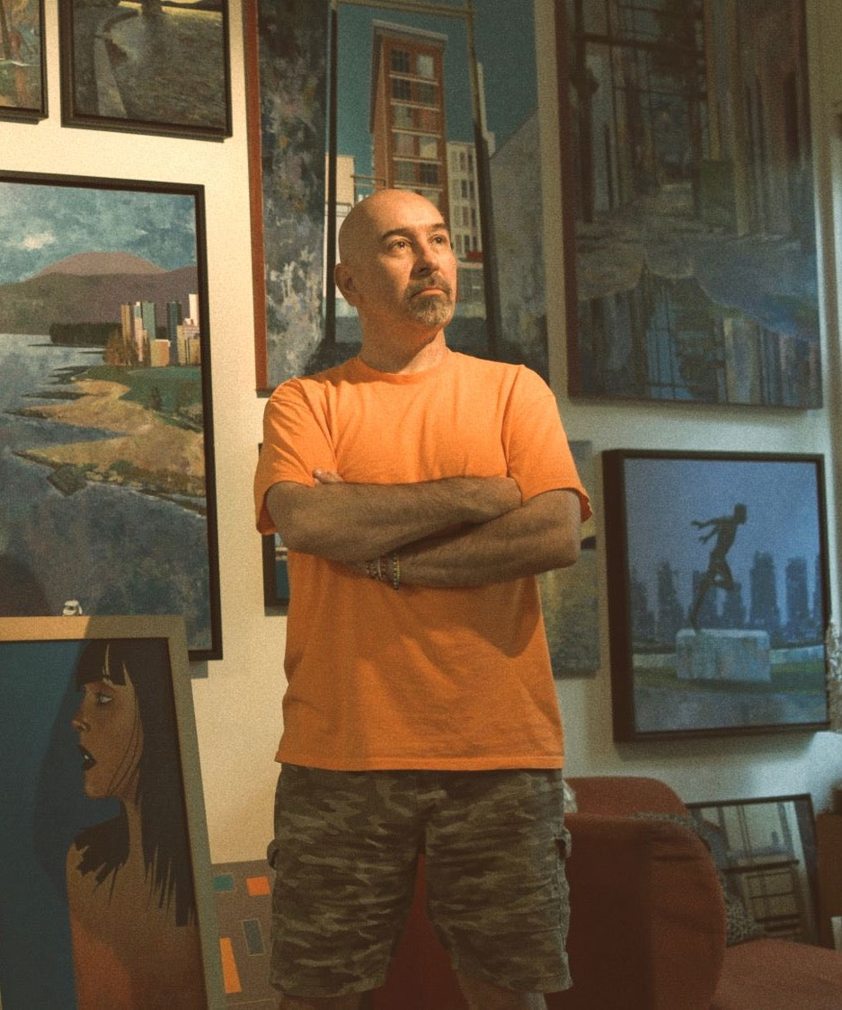 Marcus Wild with his paintings